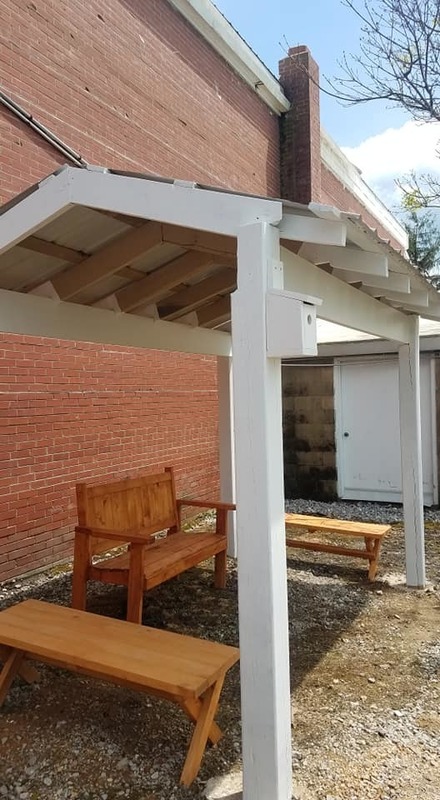 benches under a brand new shelter